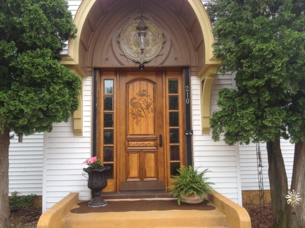 hand-carved entry door to a historic church conversion