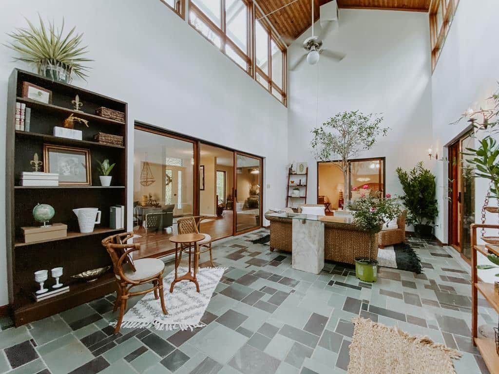 Atrium view from the inside. The atrium extends above the earth in this earth sheltered home.