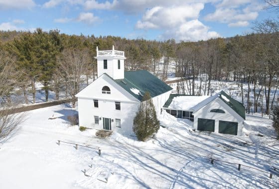 Aerial view of Historic Church Conversion on a country road