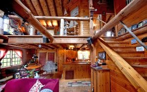 Great room open to the kitchen and dining room at the Shady Oak Log Cottage