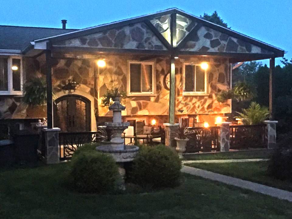 Evening view of the front of the Contemporary Multi-Generational House