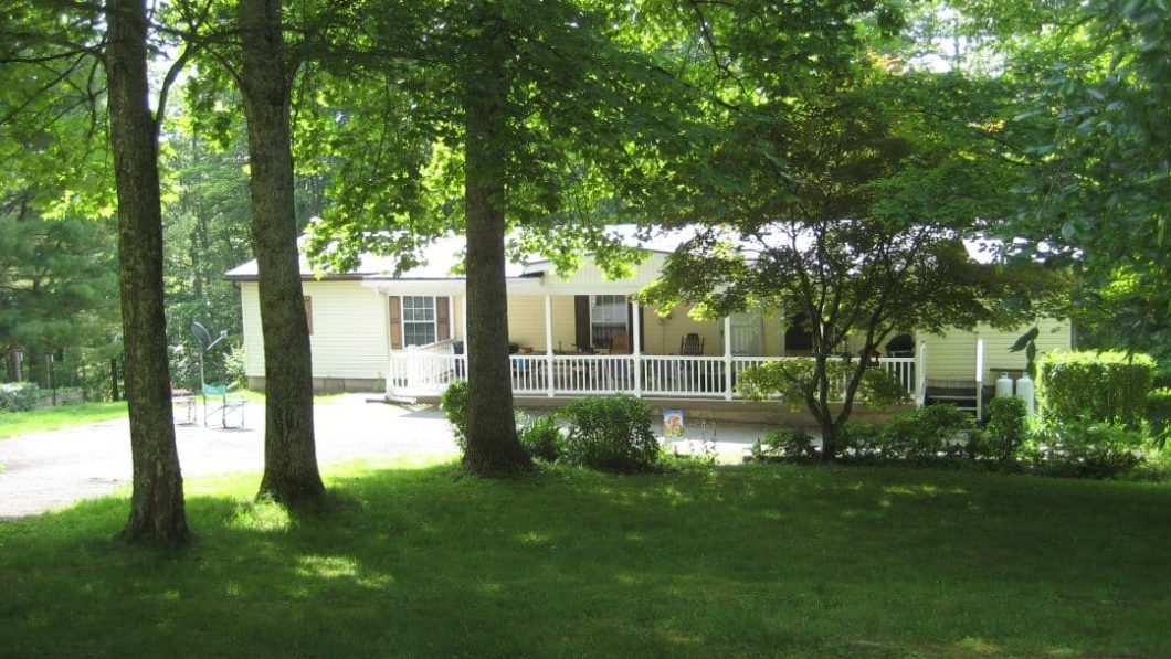 Front view of the prepper home with bunker