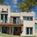 rear and deck view of the high country hacienda showing windows designed to aid in passive solar.